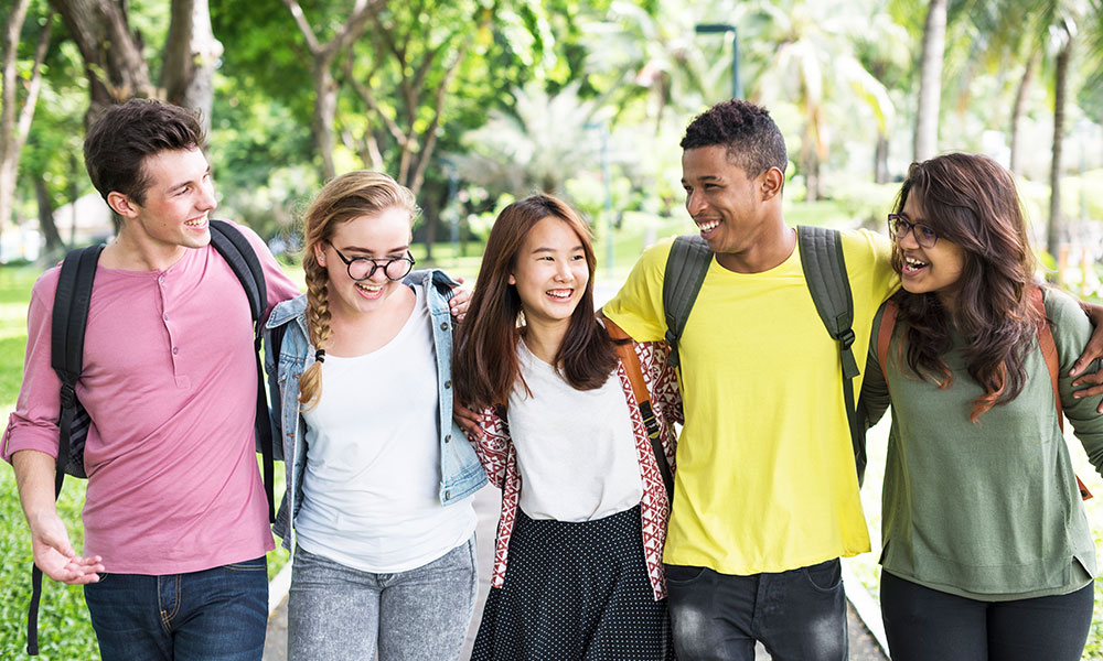 Diverse students walking outside